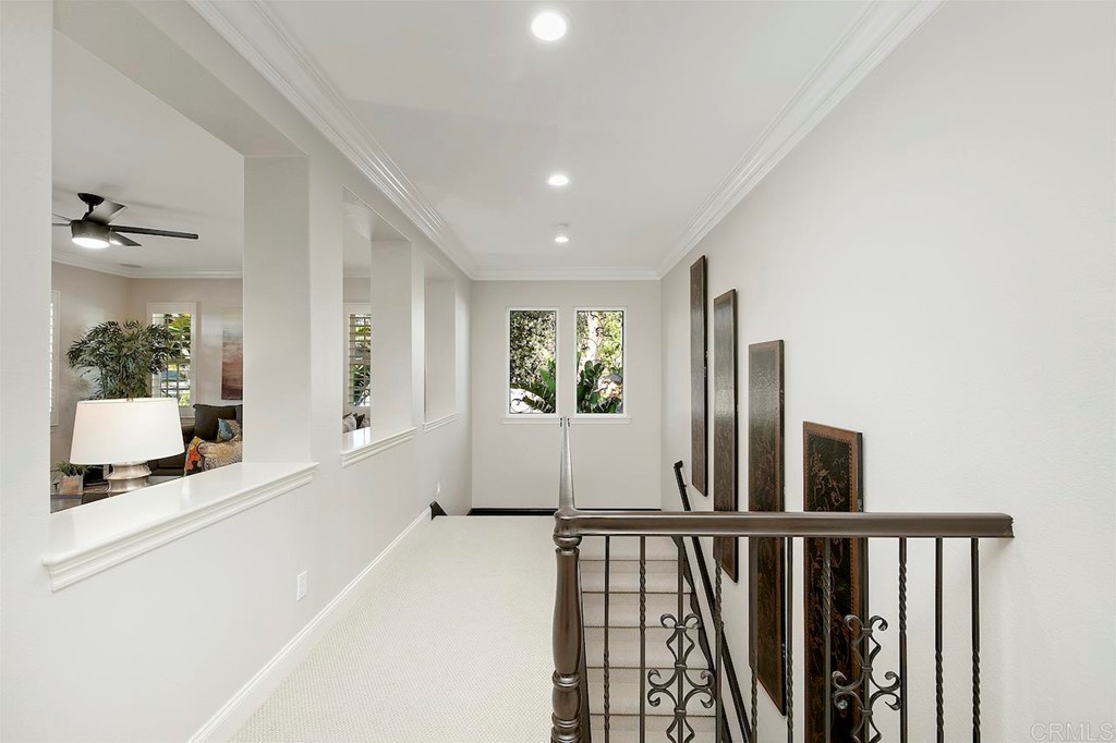 3220 Sitio Montecillo Carlsbad, CA 92009 - Photo 20 of 48 a view of a hallway to a livingroom with furniture