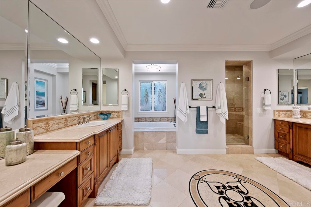 3220 Sitio Montecillo Carlsbad, CA 92009 - Photo 26 of 48 a large bathroom with a tub sink and mirror