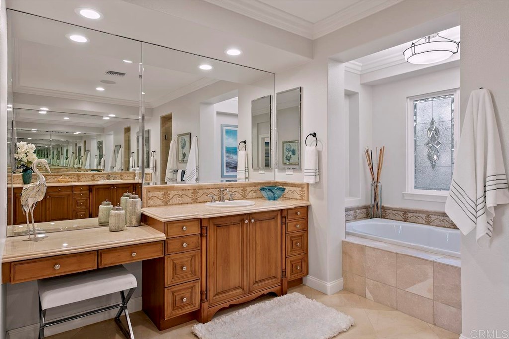 3220 Sitio Montecillo Carlsbad, CA 92009 - Photo 27 of 48 a bathroom with a sink double vanity and a mirror