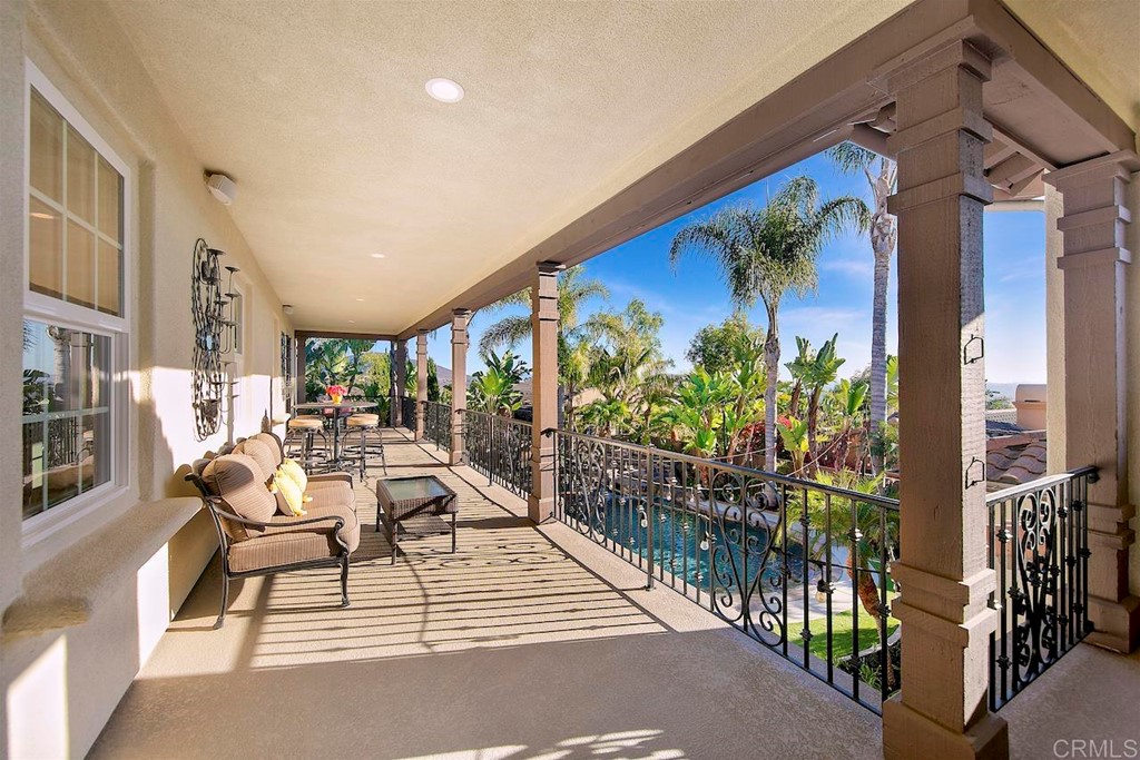 3220 Sitio Montecillo Carlsbad, CA 92009 - Photo 32 of 48 a view of a patio with dining table and chairs with potted plants