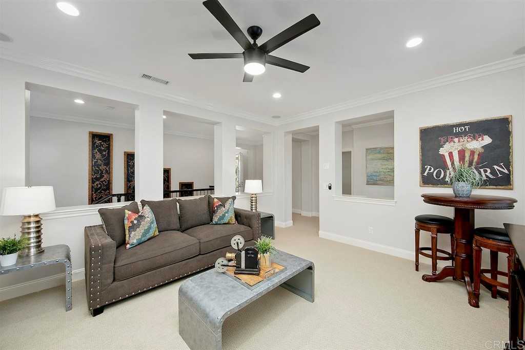 3220 Sitio Montecillo Carlsbad, CA 92009 - Photo 38 of 48 a living room with furniture and a painting on the wall