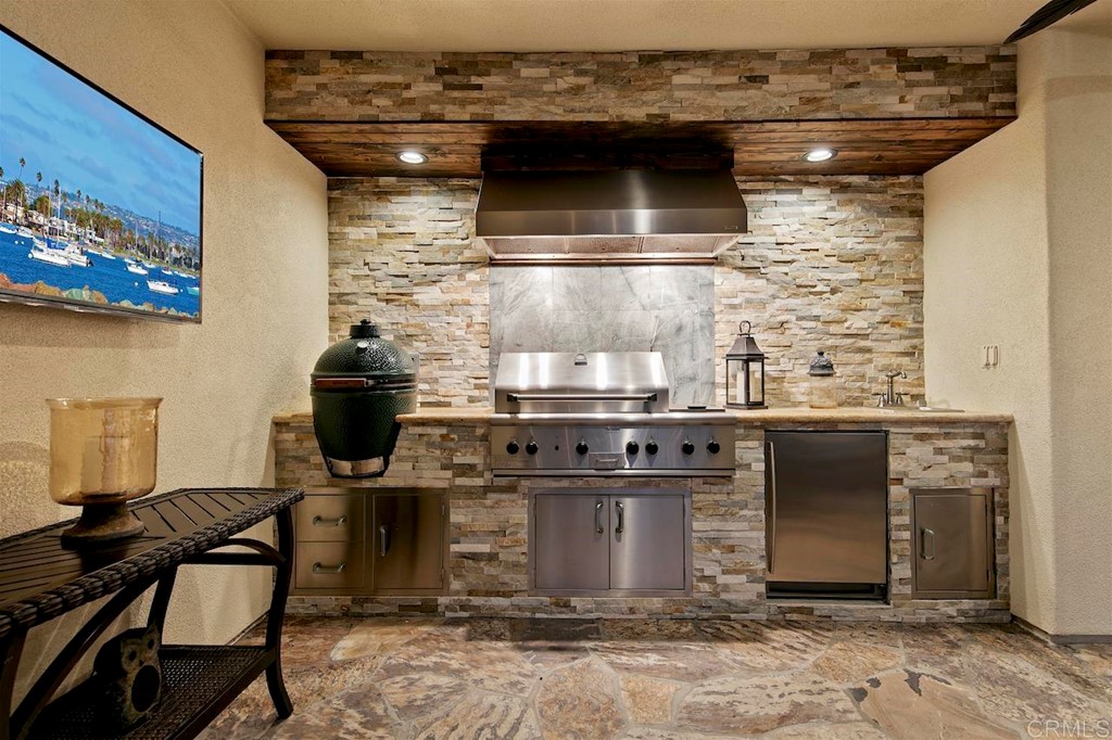 3220 Sitio Montecillo Carlsbad, CA 92009 - Photo 44 of 48 a kitchen with a stove and a microwave