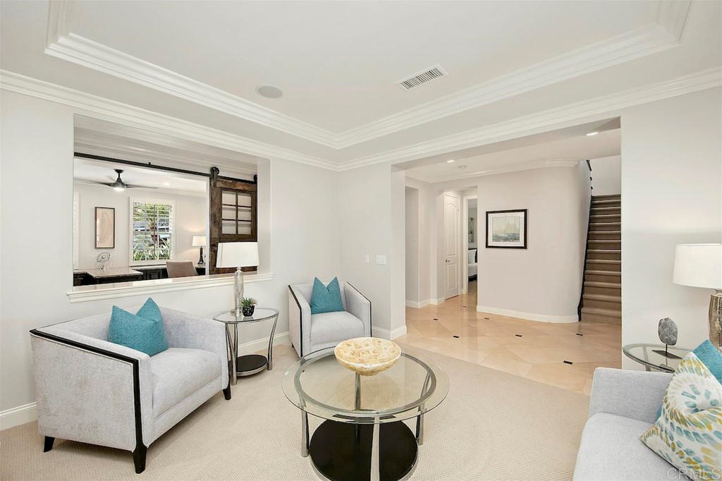 3220 Sitio Montecillo Carlsbad, CA 92009 - Photo 6 of 48 a living room with furniture and a large window