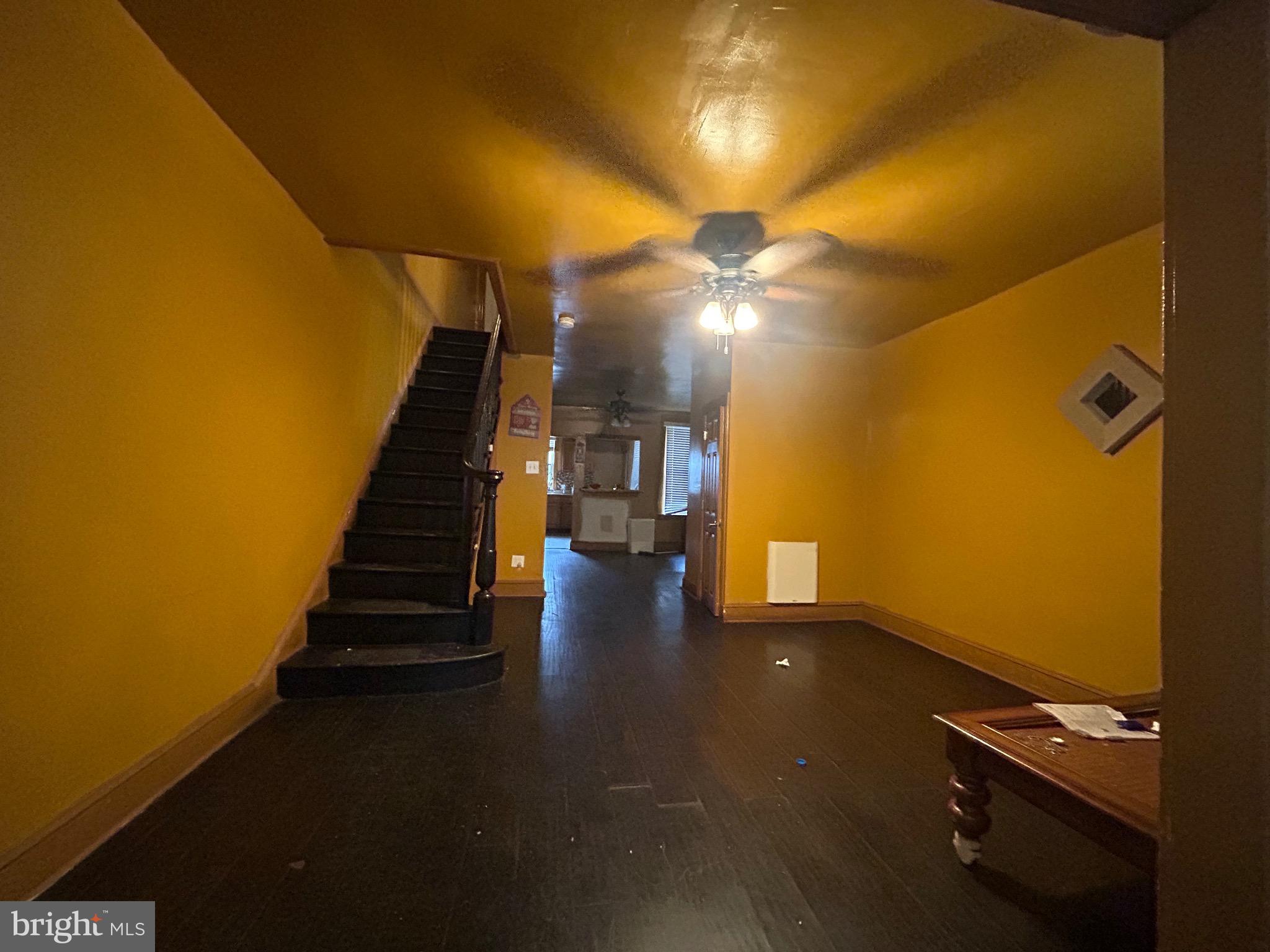 a view of an empty room with stairs