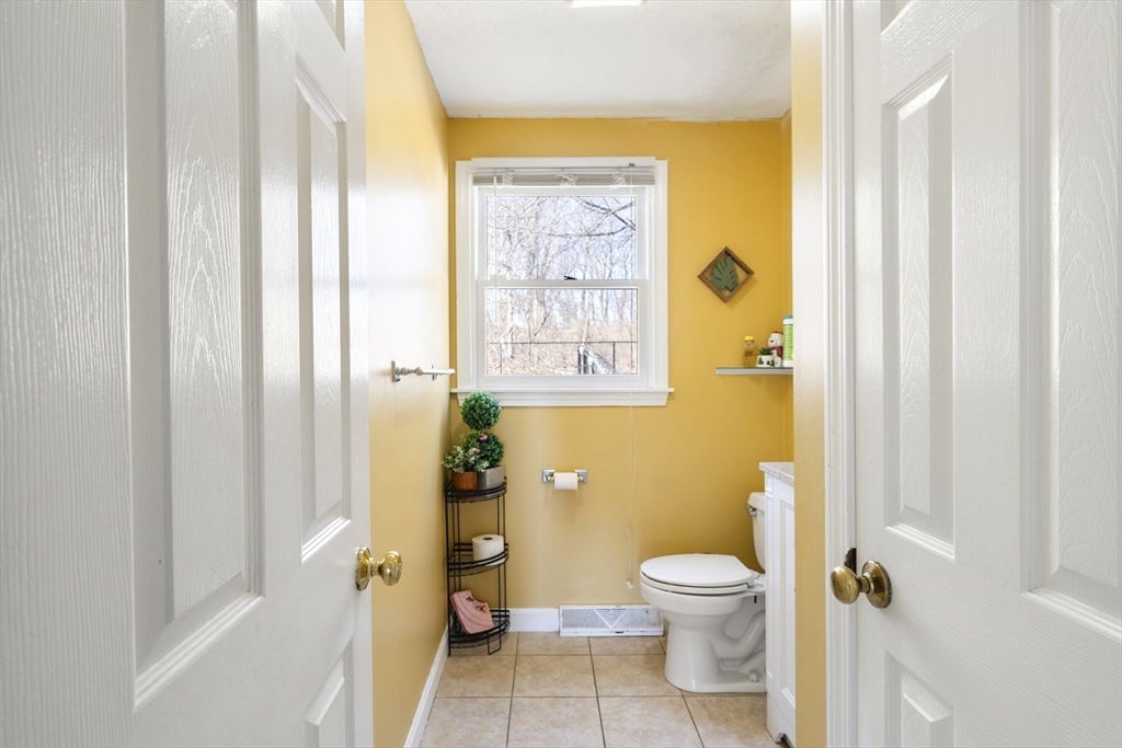 7 Overlook Avenue Haverhill, MA 01832 - Photo 13 of 32 a bathroom with a granite countertop toilet a sink and a shower