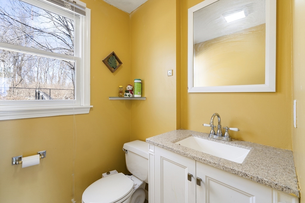 7 Overlook Avenue Haverhill, MA 01832 - Photo 14 of 32 a bathroom with a granite countertop toilet sink and mirror