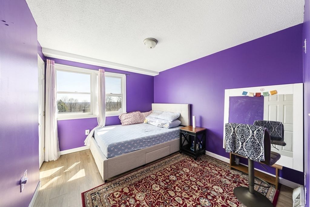7 Overlook Avenue Haverhill, MA 01832 - Photo 17 of 32 a bedroom with a bed and wooden floor