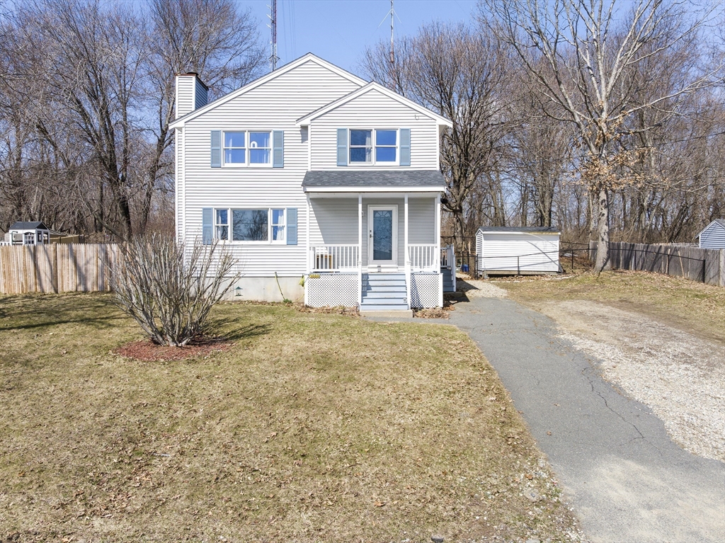 7 Overlook Avenue Haverhill, MA 01832 - Photo 2 of 32 a front view of a house with a yard and garage