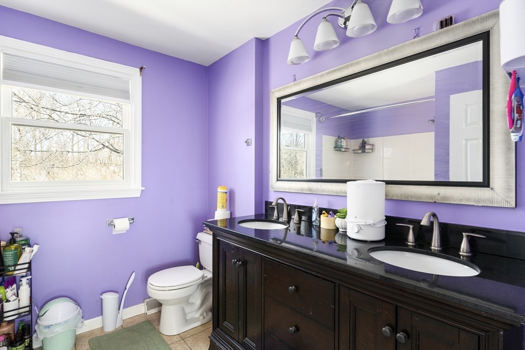7 Overlook Avenue Haverhill, MA 01832 - Photo 21 of 32 a bathroom with a granite countertop sink mirror and toilet