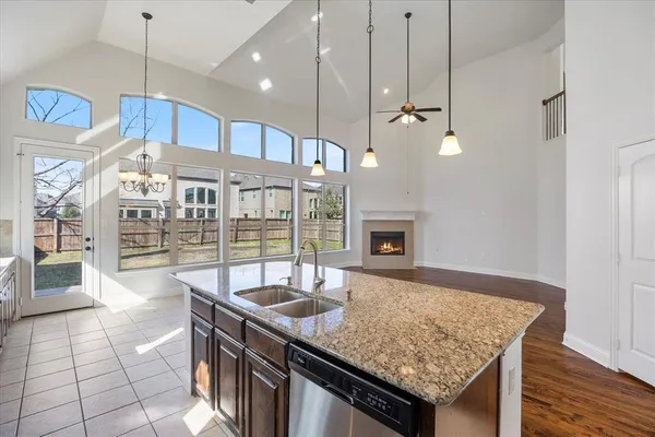 a view of a house with a yard and sitting area