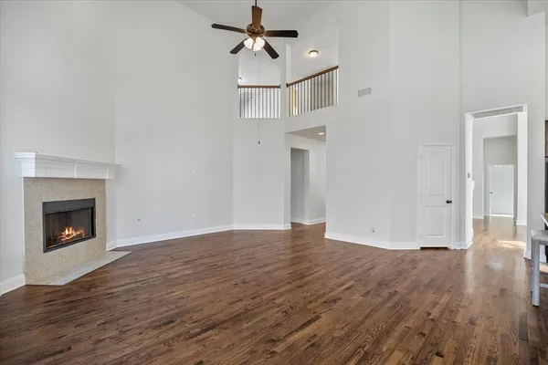 a large kitchen with kitchen island granite countertop a stove a sink and a refrigerator