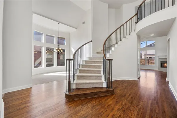a view of entryway with wooden floor and stairs