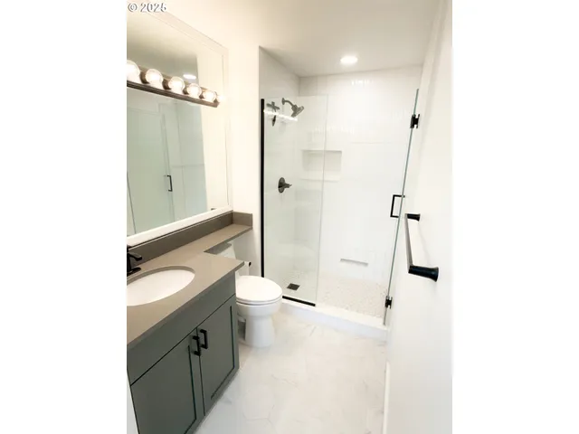 a bathroom with a sink and toilet