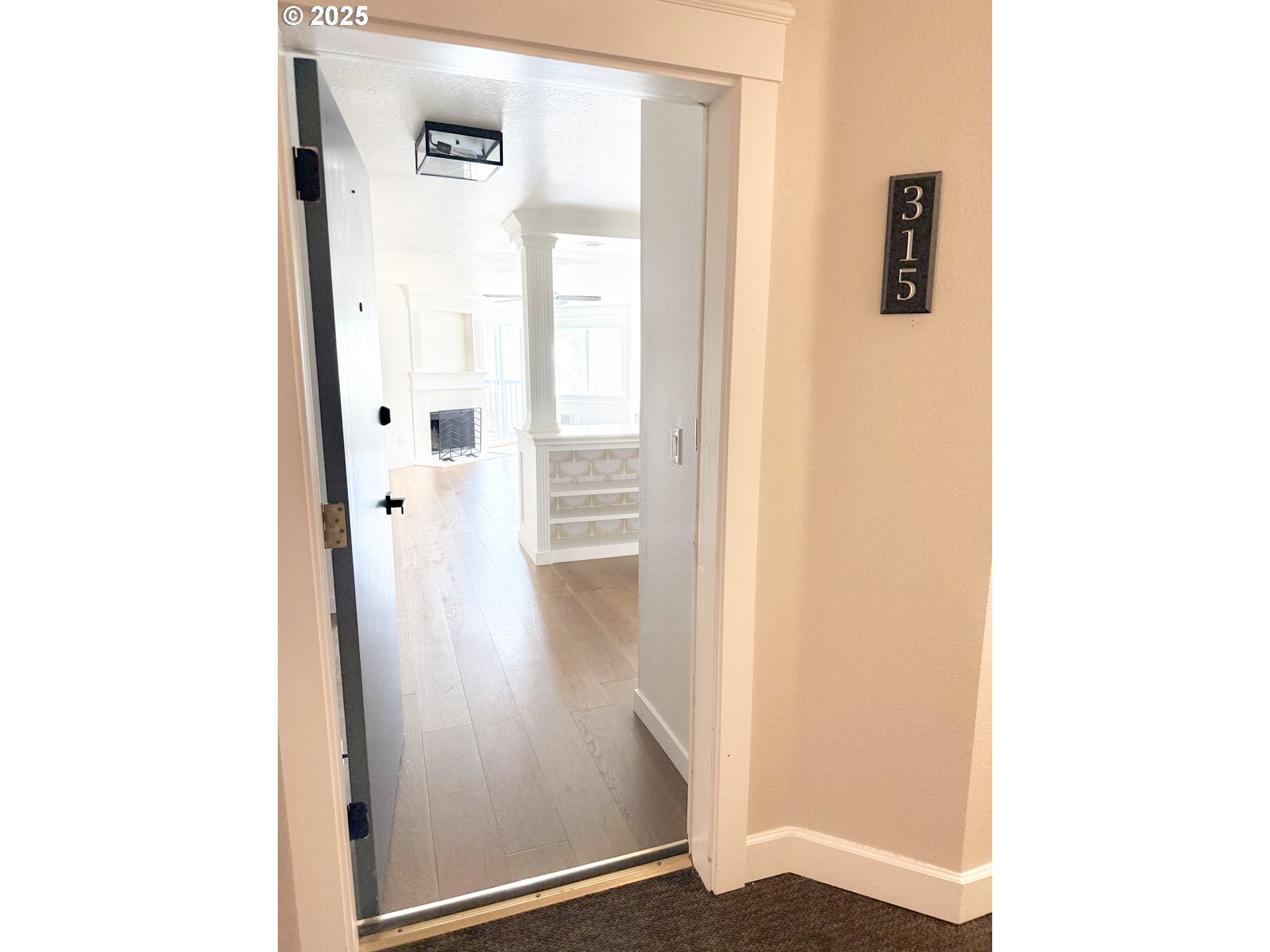 8720 Southwest Tualatin Road, Unit 315 Tualatin, OR 97062 - Photo 23 of 41 a view of a hallway with wooden floor