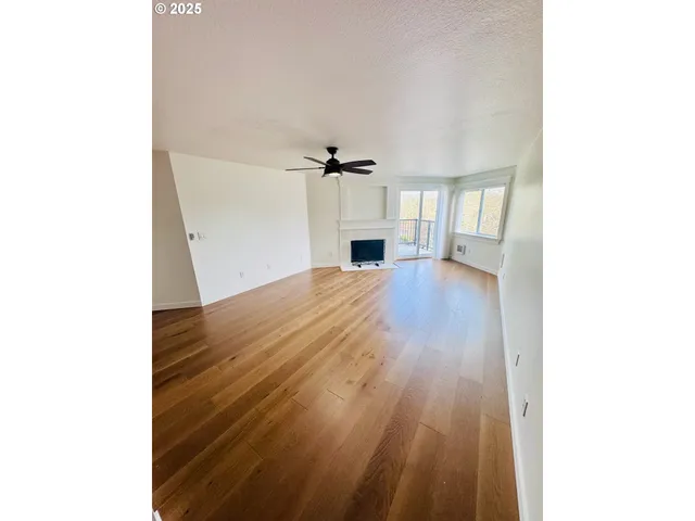 a view of an empty room with stairs