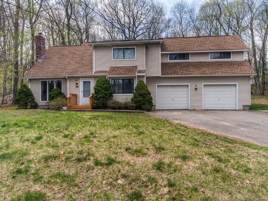 36 Juggernaut Road Prospect, CT 06712 - Photo 1 of 1 a front view of a house with a yard and garage