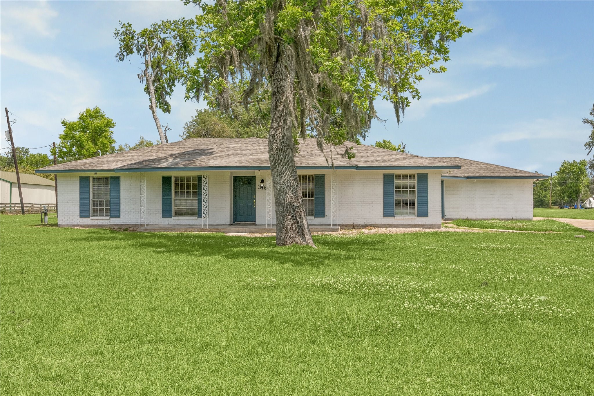 316 Rabbit Trail Lake Jackson, TX 77566 - Photo 1 of 16 a view of a house with a backyard