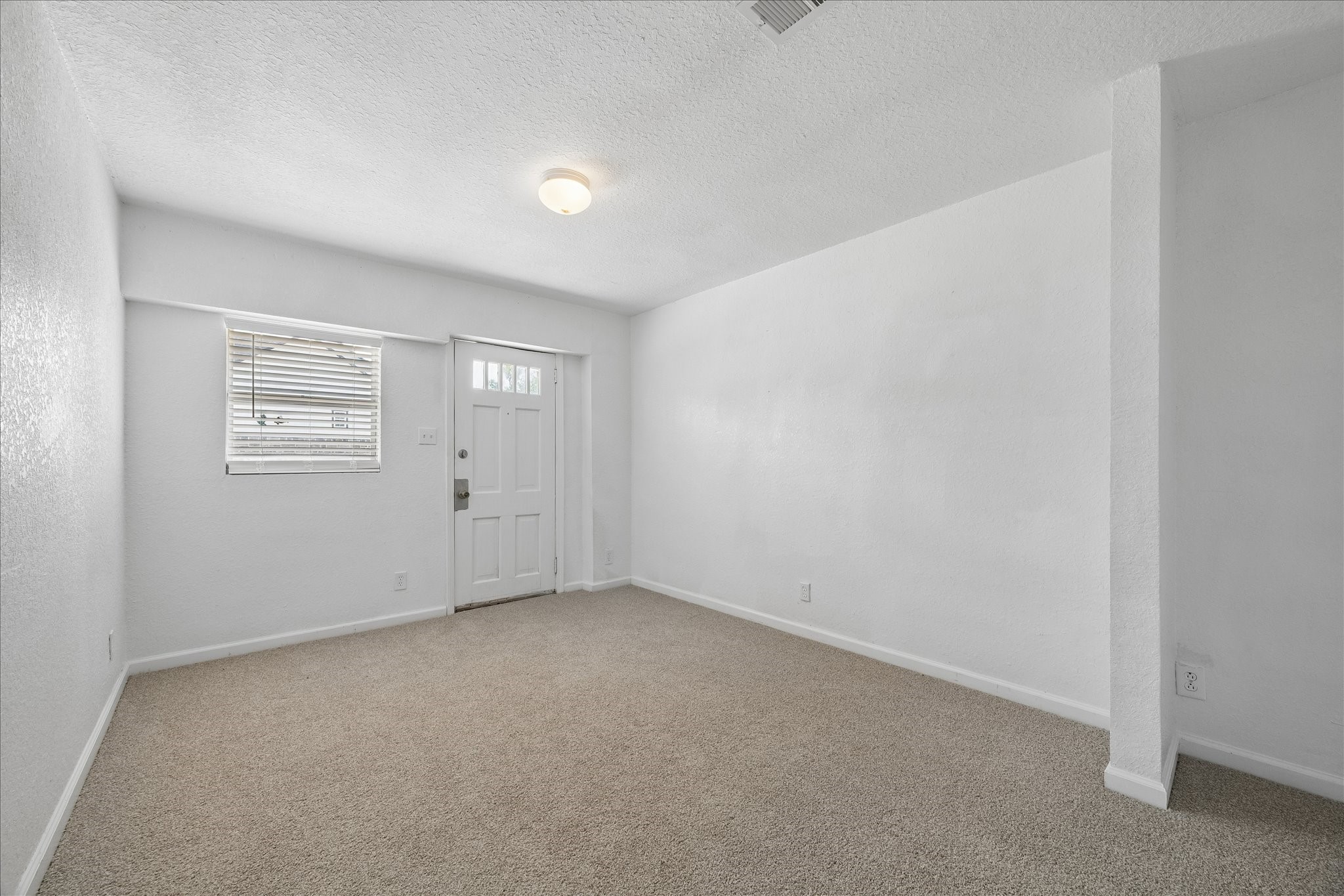 316 Rabbit Trail Lake Jackson, TX 77566 - Photo 12 of 16 a view of an empty room with a window
