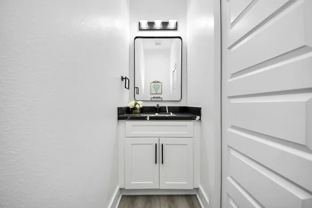 a bathroom with a sink and a mirror