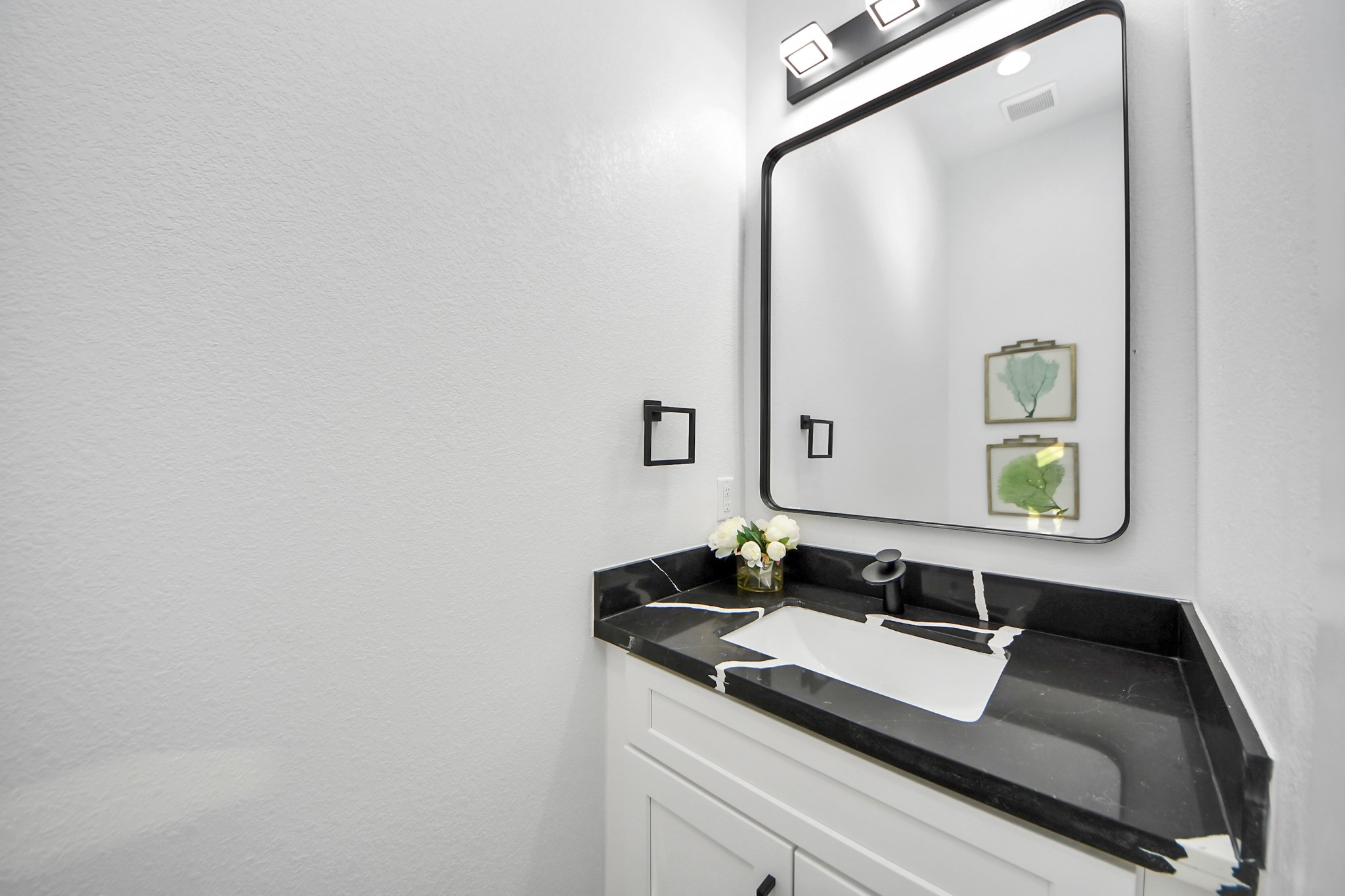 8533 Amadwe Street, Unit A Houston, TX 77051 - Photo 18 of 36 a bathroom with a sink and a mirror