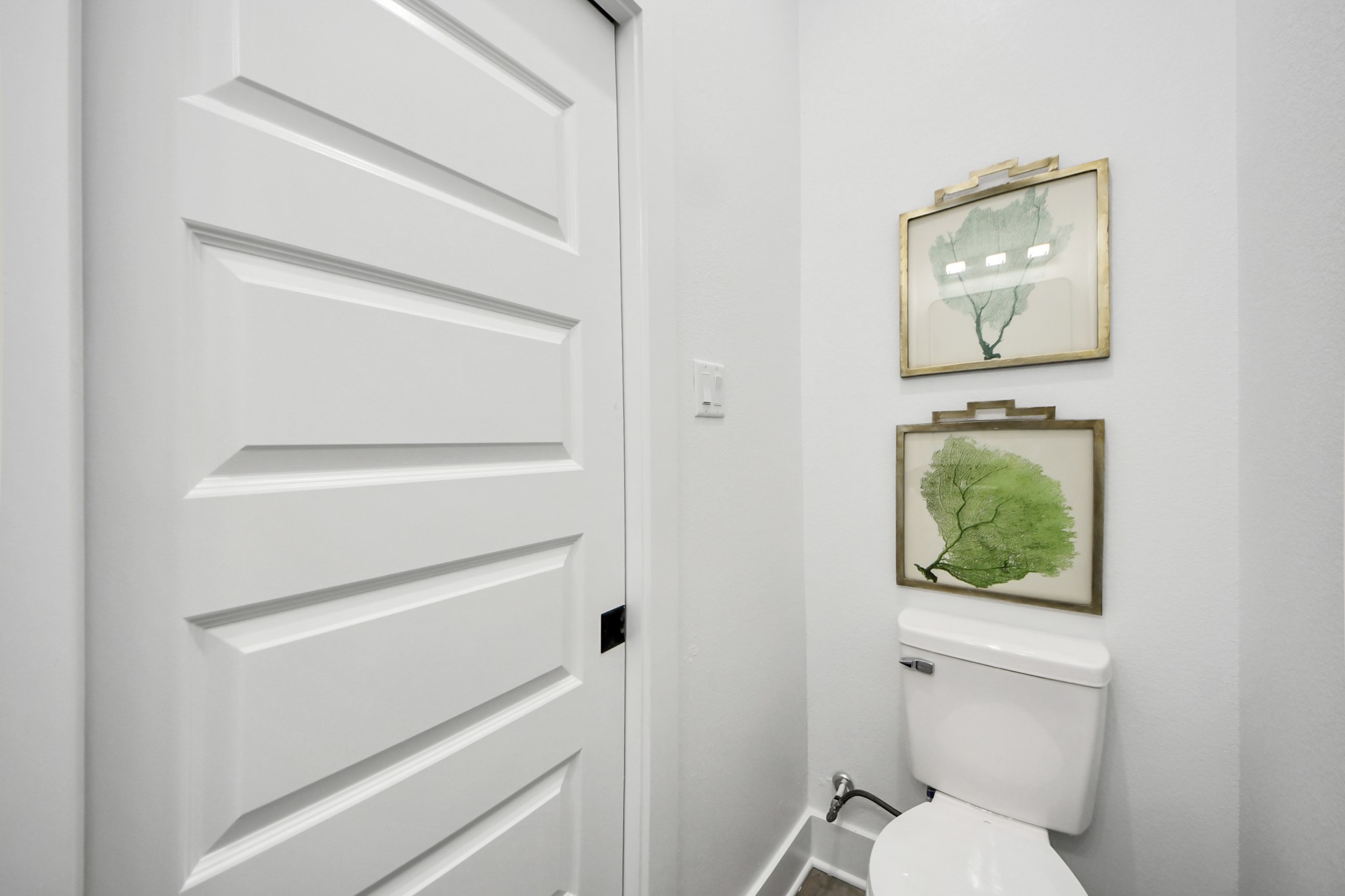 8533 Amadwe Street, Unit A Houston, TX 77051 - Photo 19 of 36 a bathroom with a toilet a sink and mirror