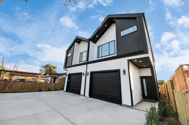 a front view of a house with garage