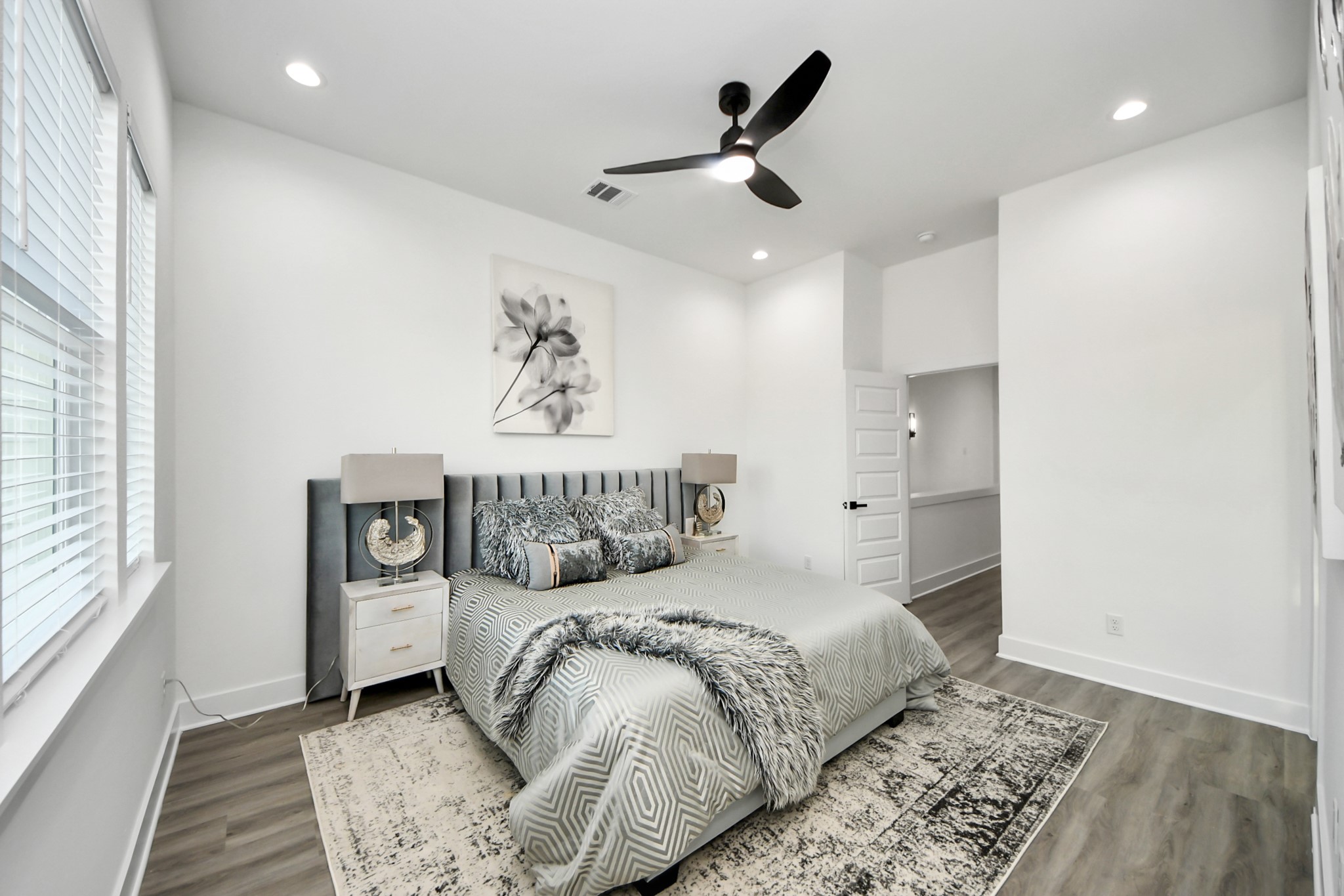 8533 Amadwe Street, Unit A Houston, TX 77051 - Photo 22 of 36 a bedroom with a large bed and a window