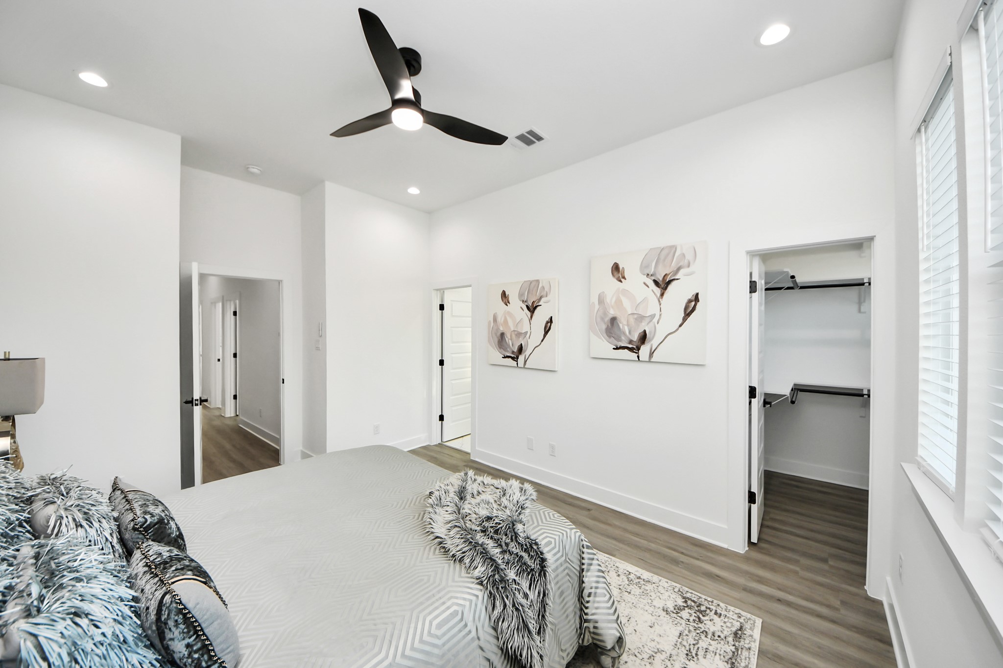 8533 Amadwe Street, Unit A Houston, TX 77051 - Photo 24 of 36 a bedroom with a bed and cabinets