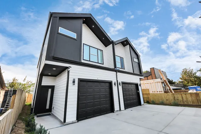 a front view of a house with a garage