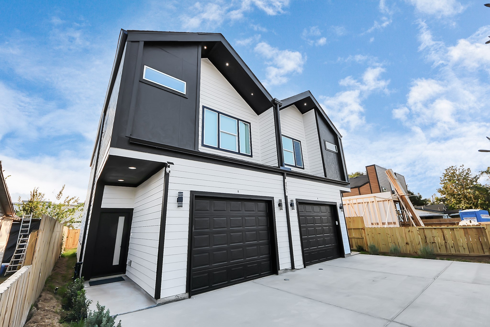 8533 Amadwe Street, Unit A Houston, TX 77051 - Photo 3 of 36 a front view of a house with a garage