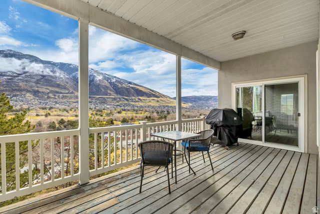 11789 Nicklaus Road Sandy, UT 84092 - Photo 48 of 58 Deck featuring a mountain view, area for grilling, and outdoor dining area