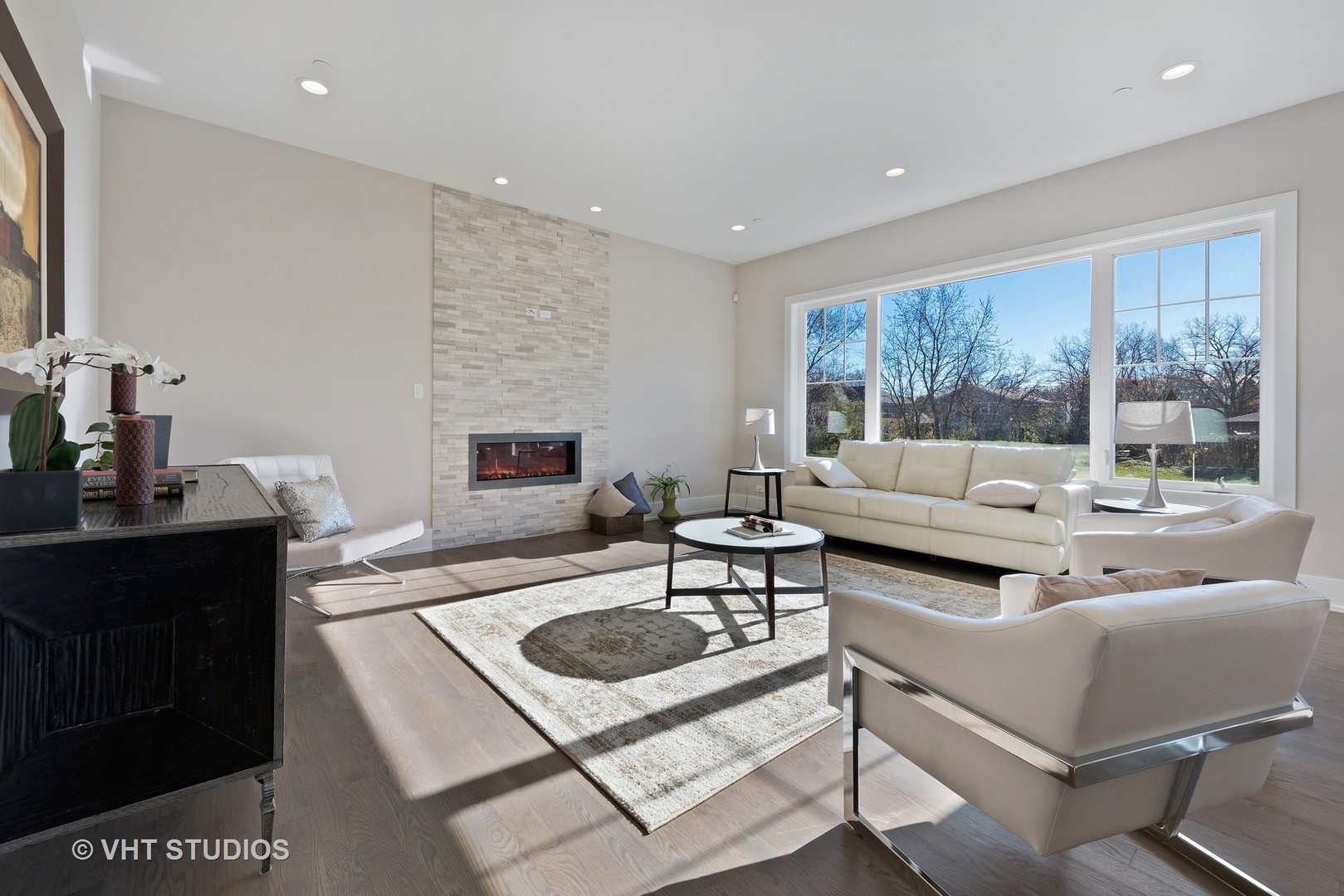 2709 Walters Avenue Northbrook, IL 60062 - Photo 11 of 33 a living room with furniture and a fireplace