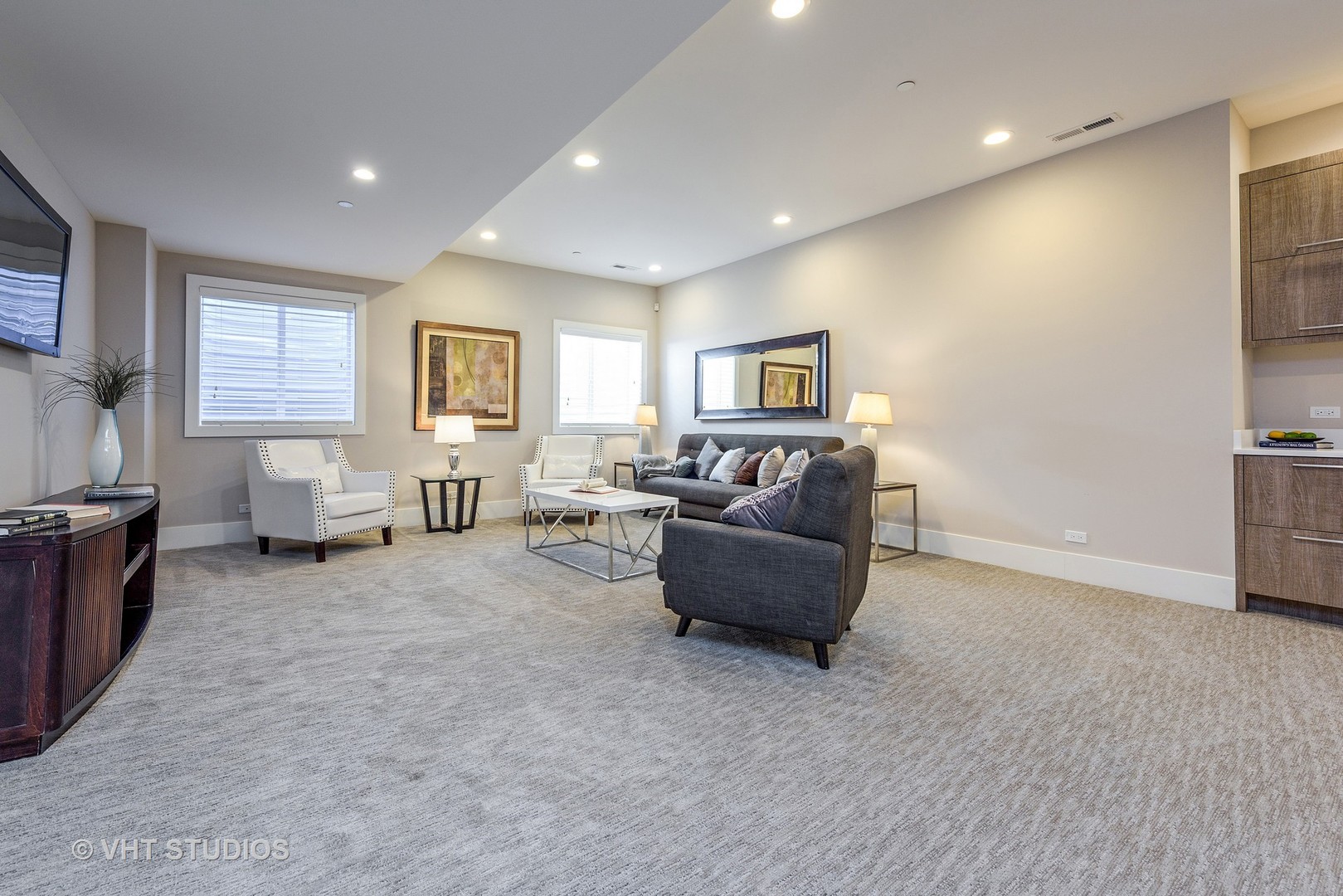 2709 Walters Avenue Northbrook, IL 60062 - Photo 15 of 33 a living room with furniture and a flat screen tv
