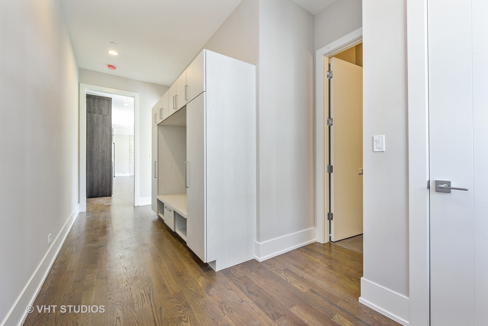 2709 Walters Avenue Northbrook, IL 60062 - Photo 17 of 33 a view of a hallway with wooden floor