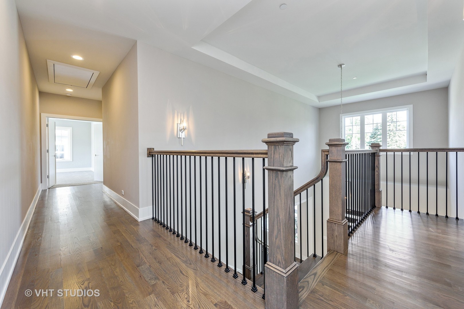 2709 Walters Avenue Northbrook, IL 60062 - Photo 18 of 33 a view of a hallway with wooden floor and windows
