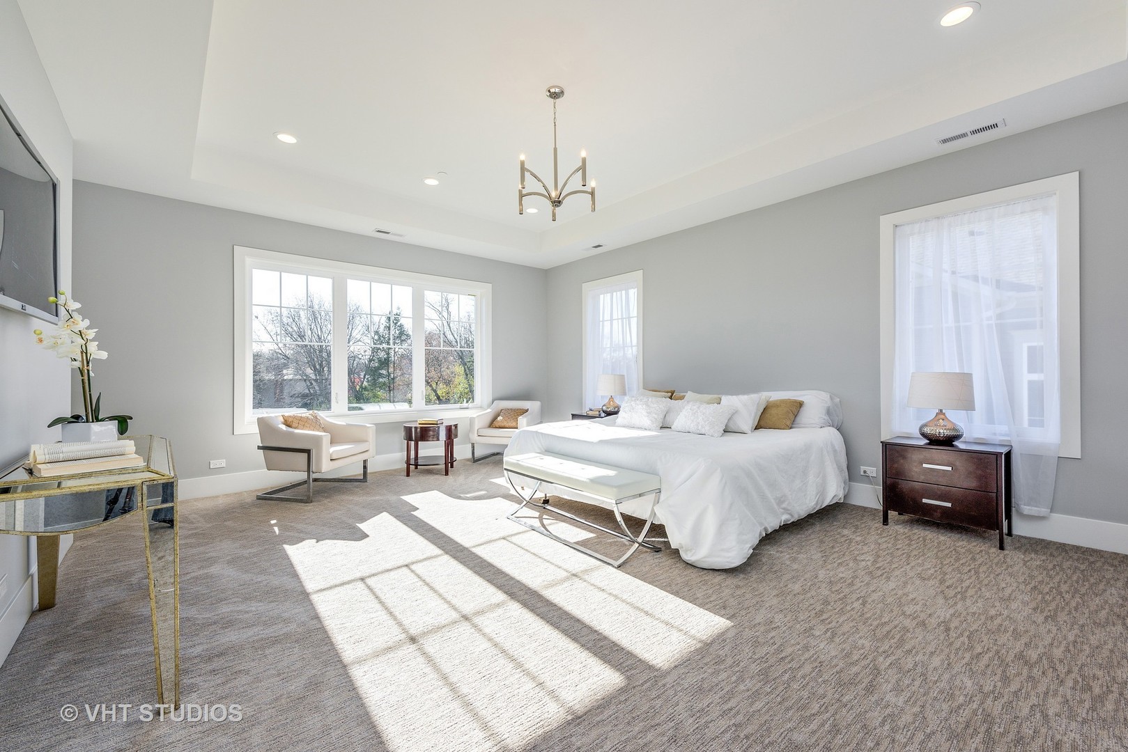 2709 Walters Avenue Northbrook, IL 60062 - Photo 19 of 33 a spacious bedroom with a bed and large window