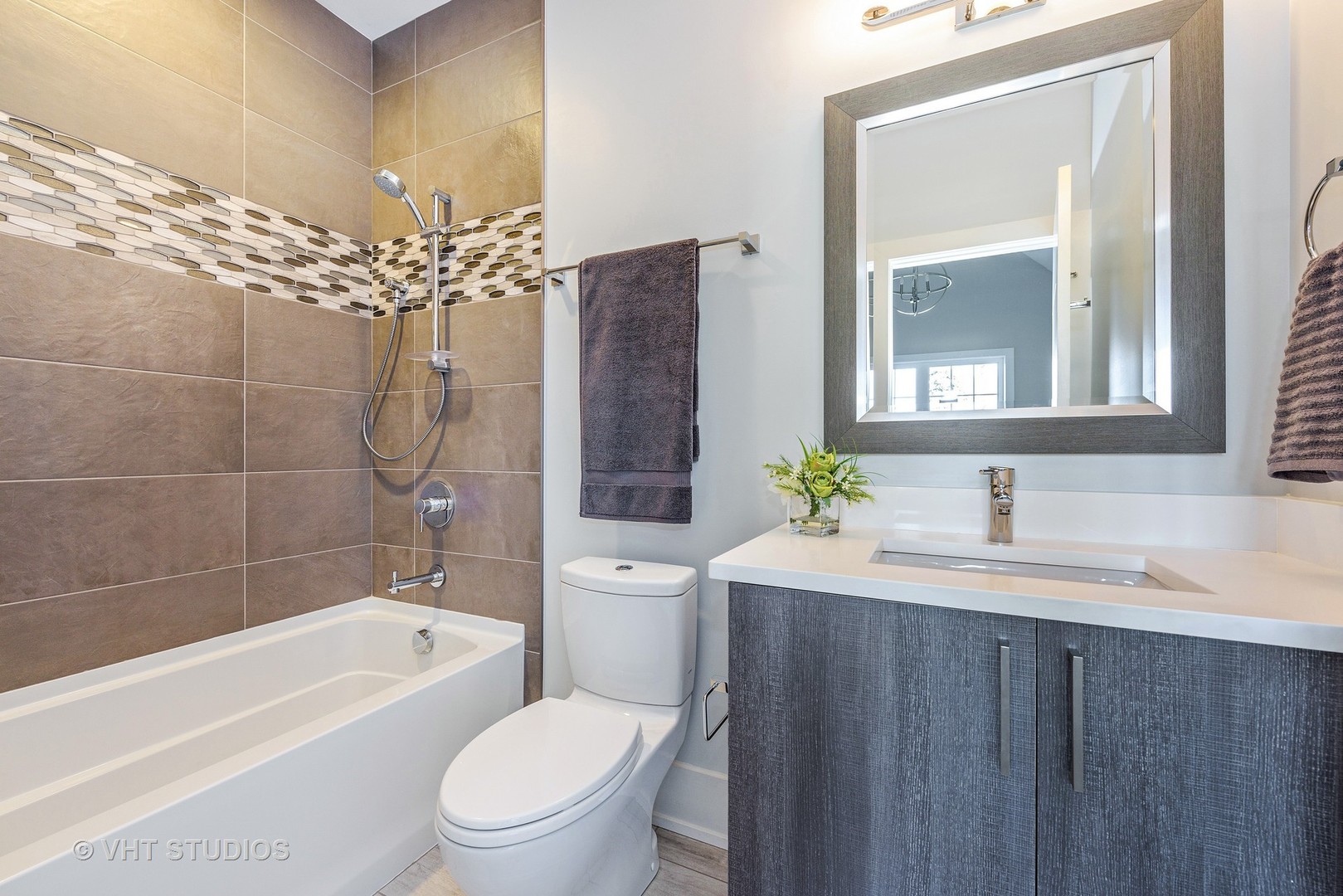 2709 Walters Avenue Northbrook, IL 60062 - Photo 28 of 33 a bathroom with a sink a toilet and shower