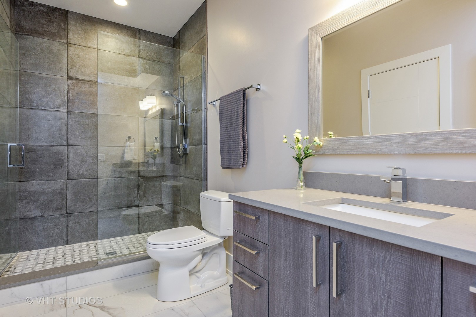 2709 Walters Avenue Northbrook, IL 60062 - Photo 29 of 33 a bathroom with a sink toilet and shower
