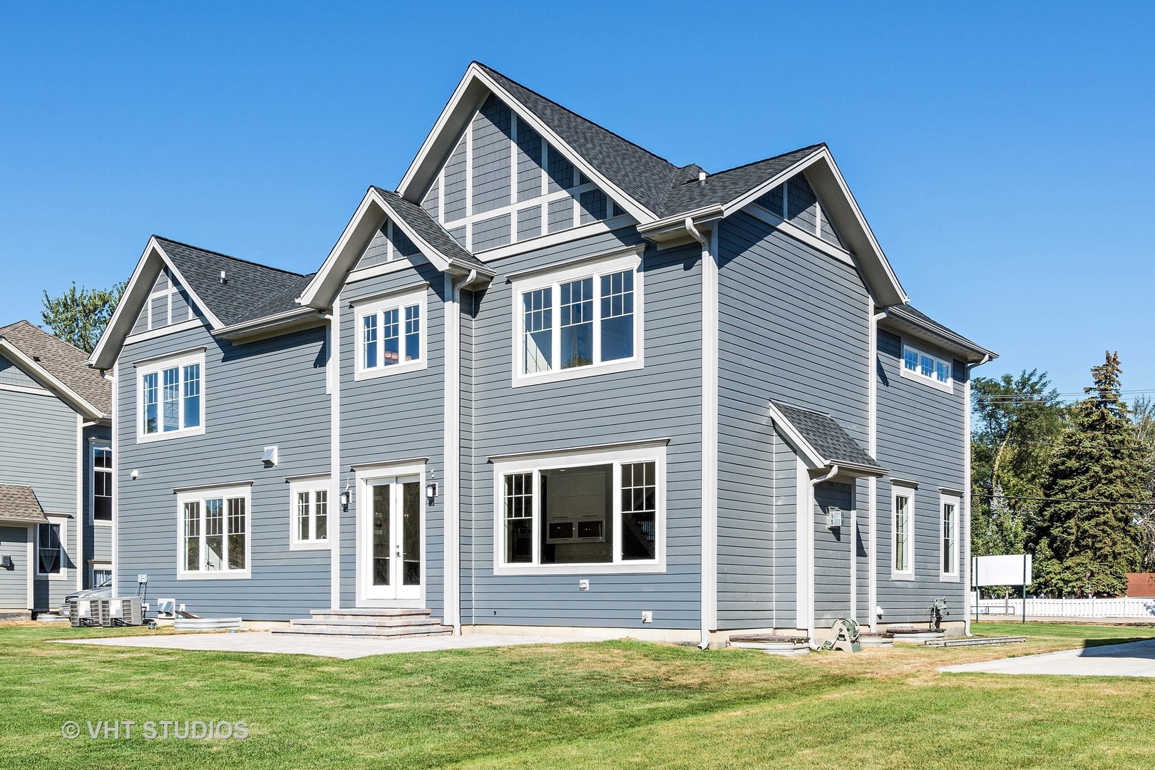 2709 Walters Avenue Northbrook, IL 60062 - Photo 33 of 33 a front view of a house with a yard