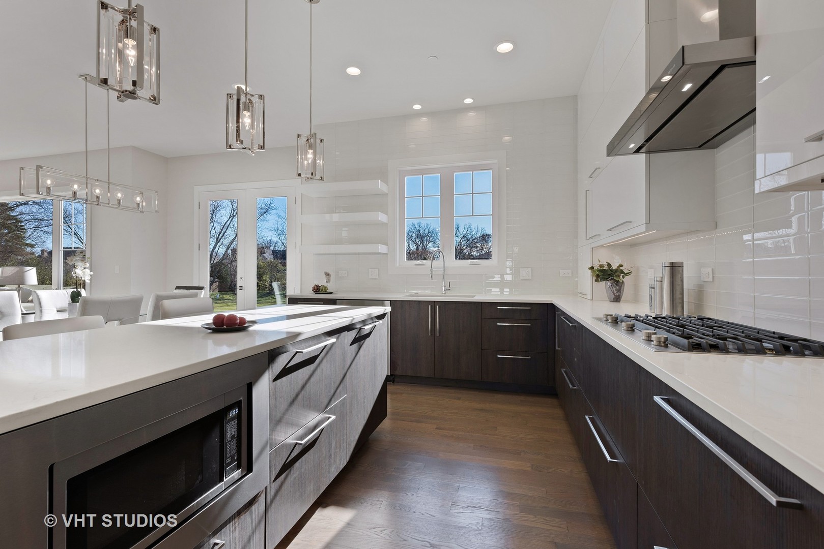 2709 Walters Avenue Northbrook, IL 60062 - Photo 5 of 33 a kitchen with stainless steel appliances granite countertop a sink a stove and a refrigerator