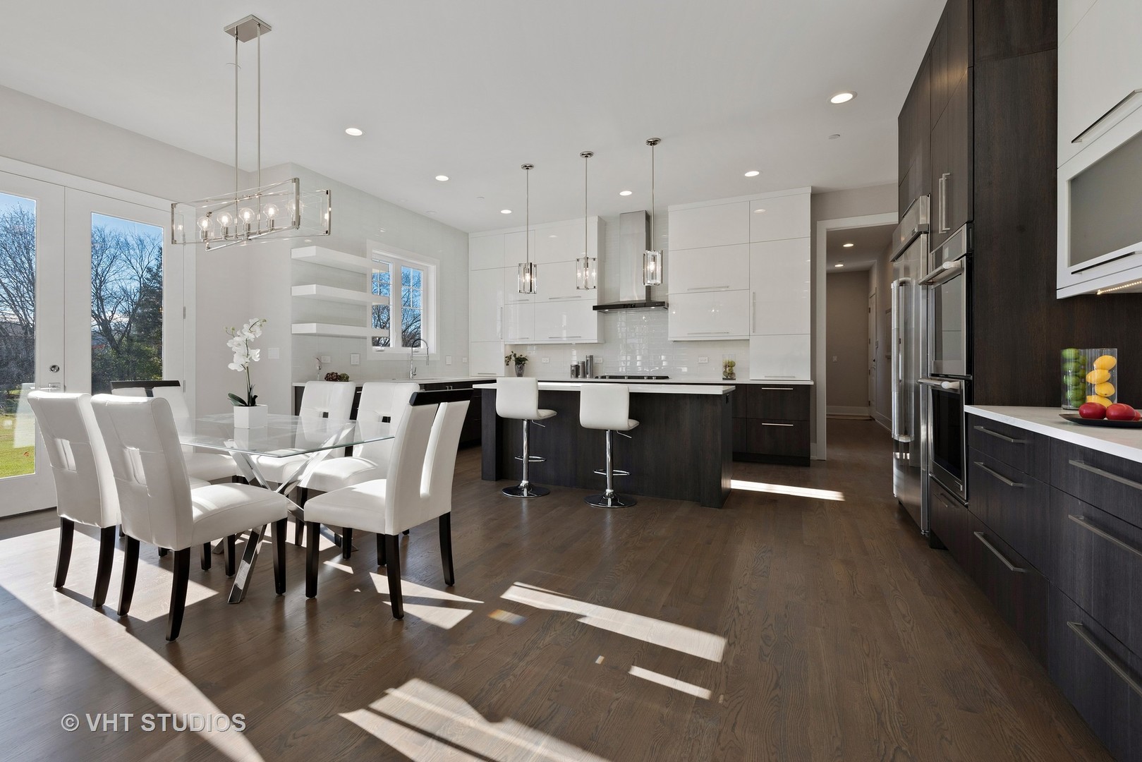2709 Walters Avenue Northbrook, IL 60062 - Photo 7 of 33 a large kitchen with a table and chairs