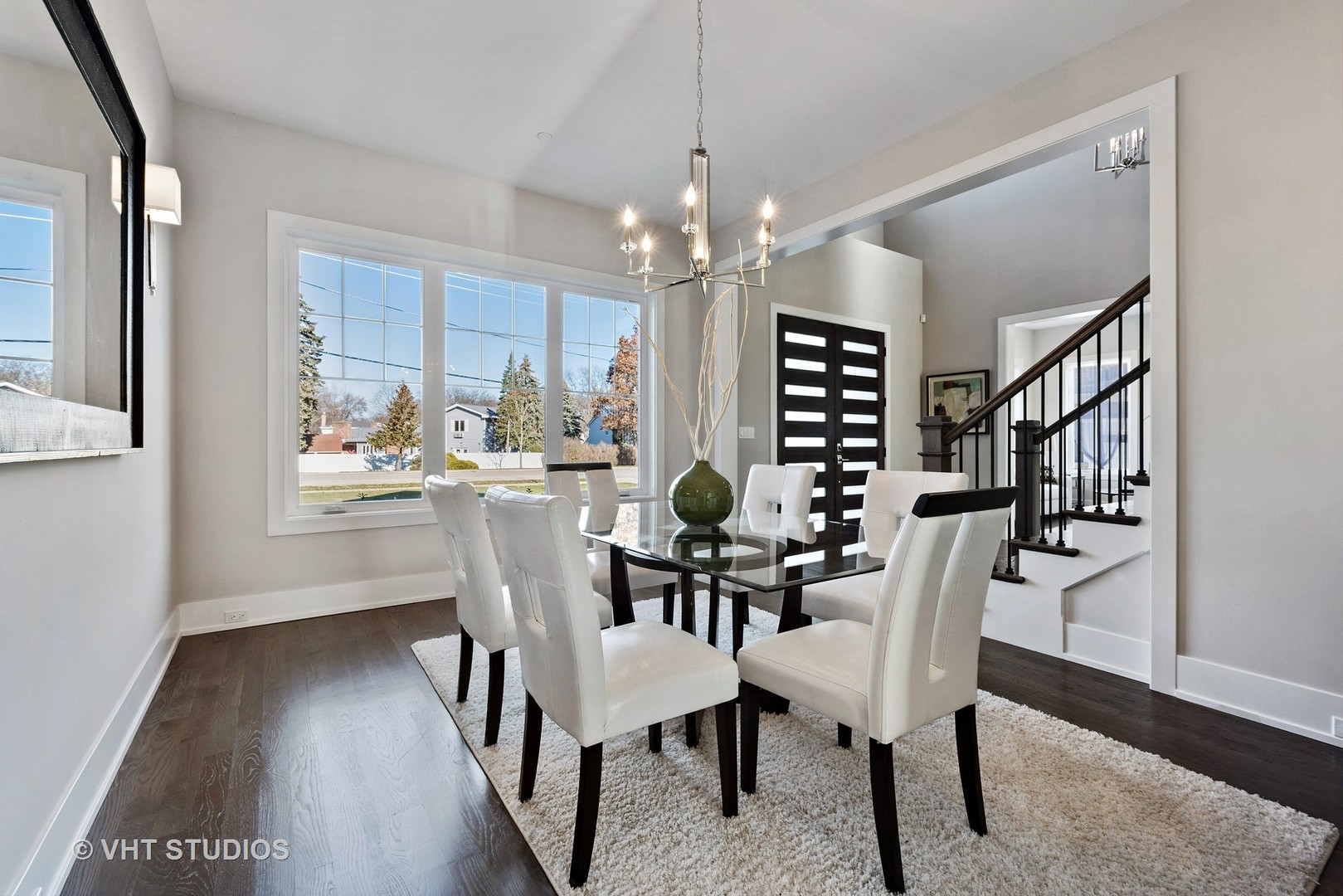 2709 Walters Avenue Northbrook, IL 60062 - Photo 9 of 33 a view of a dining room with furniture window and wooden floor