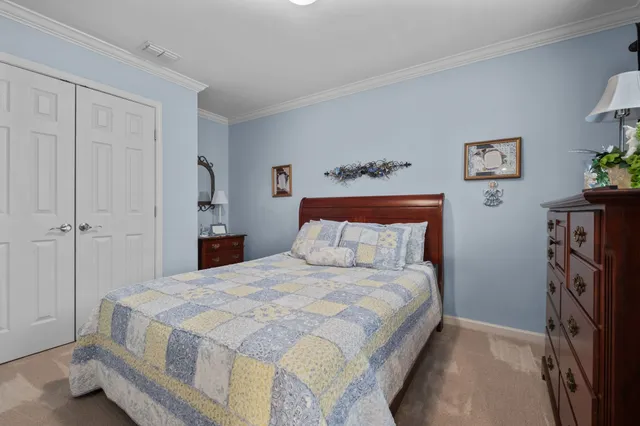 a bedroom with a bed and a tv