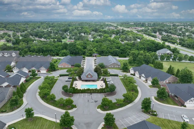 an aerial view of a house with outdoor space and street view