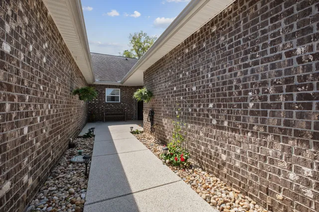 a view of a pathway with a wall