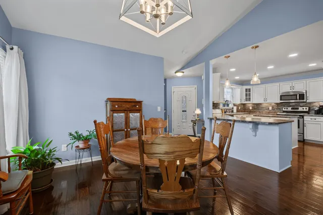 a dining room with furniture and window