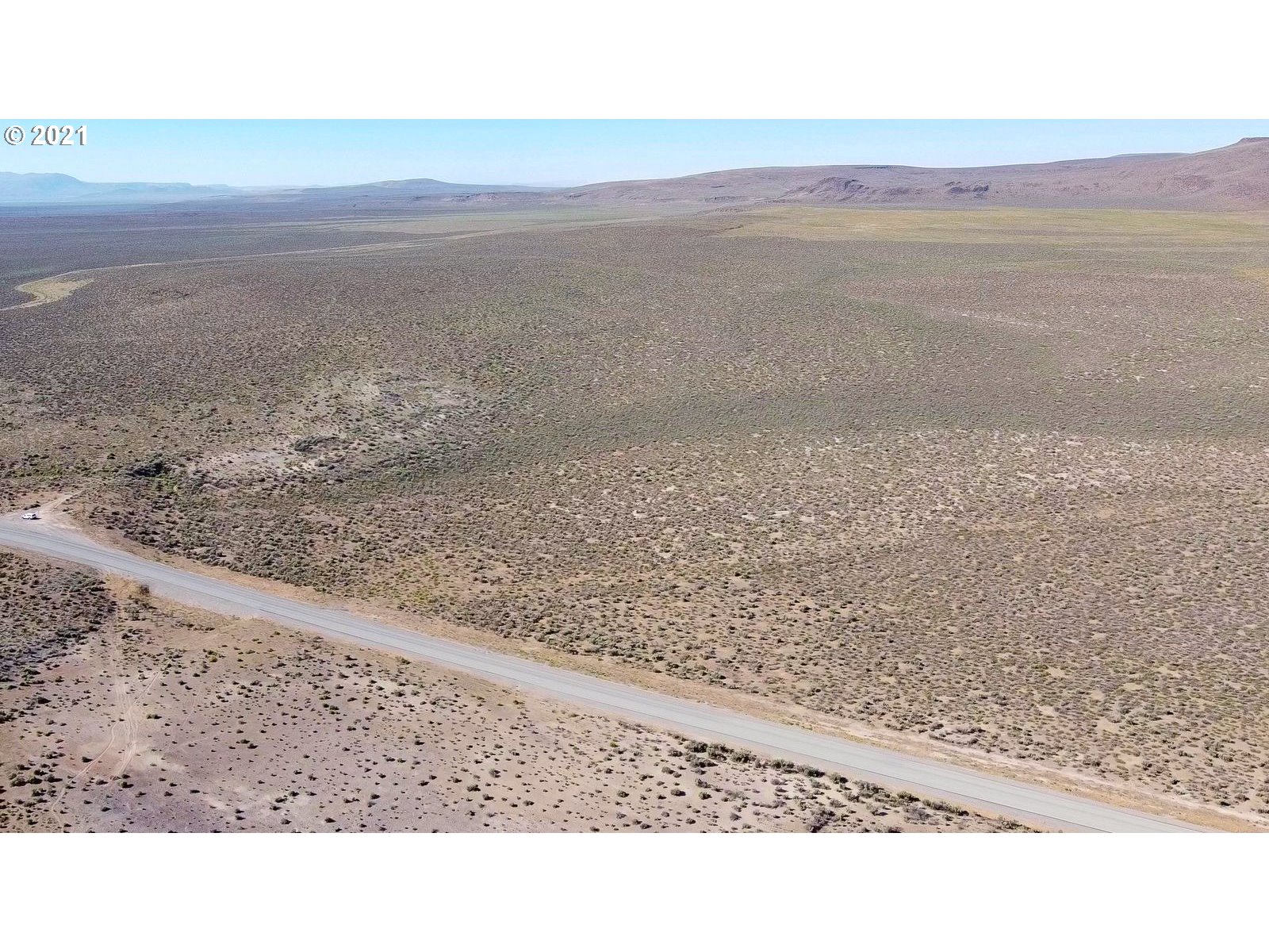 a black and white photo of a field