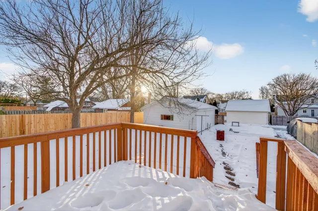 a view of a house with wooden fence