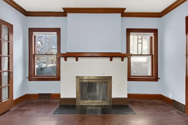 a view of livingroom with window and fireplace