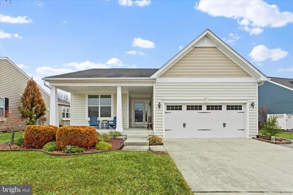 a view of a house with a yard and plants
